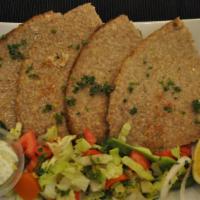 Kibbeh Platter · Stuffed with beef and lamb. Served with salad tzatziki sauce.