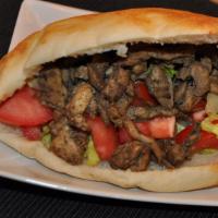 Chicken Shawarma · Thinly sliced roasted meat sandwich.