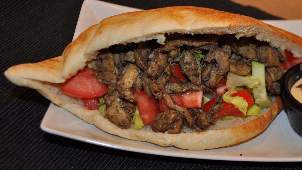 Chicken Shawarma · Thinly sliced roasted meat sandwich.