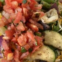 Wahoo'S Salad · Fresh field greens topped with your protein choice, guacamole, cheese, citrus slaw, and tort...
