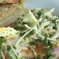 Tacos · Individually crafted with select protein, shredded cheese, citrus slaw, and cilantro sauce; ...