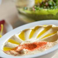 Hummus · Blend of ground chickpeas and tahini, seasoned with fresh garlic, lemon juice, and salt. Ser...