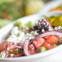 Greek Salad · Lettuce, tomatoes, cucumbers, onions, green peppers, feta cheese, olives tossed with Greek d...
