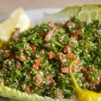 Tabouleh Salad · Diced tomatoes, onions, parsley, mint, and cracked wheat tossed with olive oil and lemon jui...