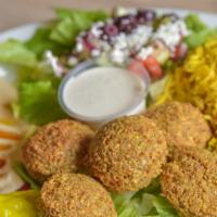 Falafel Plate · Five pieces of crispy falafel (seasoned ground chickpeas and sesame seeds), Greek salad, and...