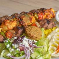 Green Corner Combo · One skewer of lamb kafta kabob, chicken kabab, beef shish kabob and one falafel served with ...