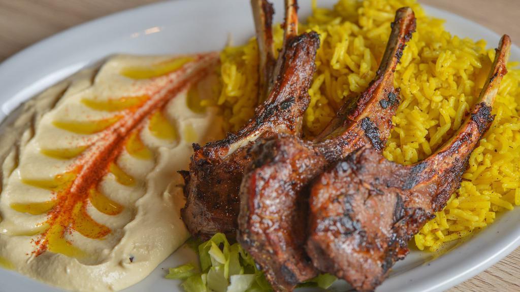 Lamb Chops · Three pieces of lamb chops with two sides.
