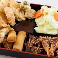 *Bento Sampler · A sampler of our favorite appetizers. This dish includes yaki prawns, chicken teriyaki, mini...