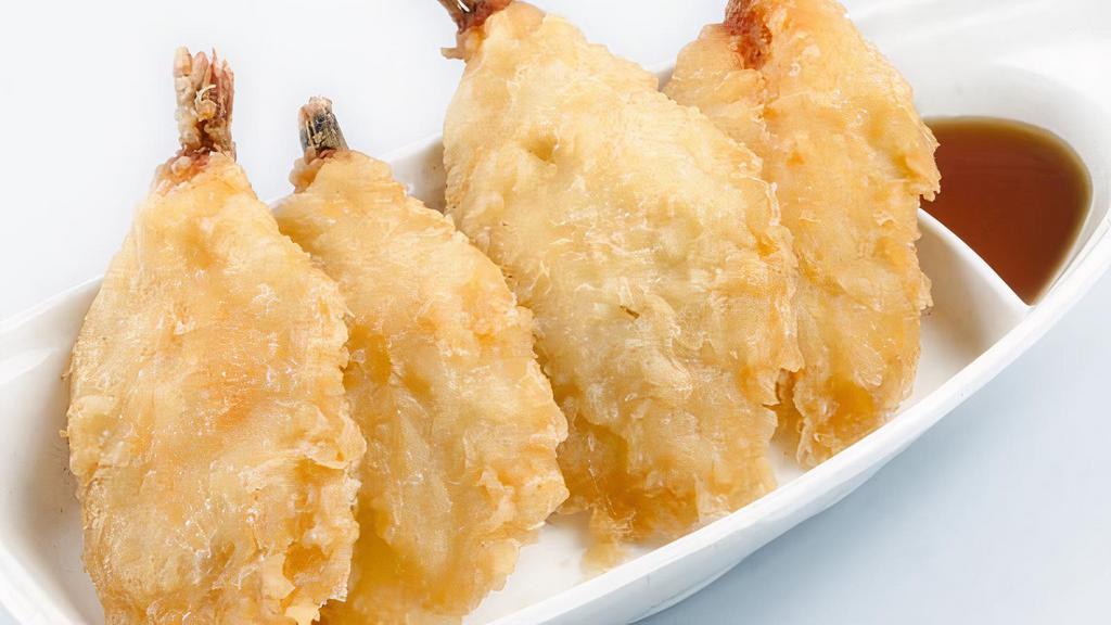 Prawn Tempura · Four butterflied prawns dipped in a light tempura batter and deep fried to a golden brown. Served with a special dipping sauce.