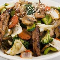 Stir Fried Vegetables · An assortment of vegetables including cabbage, zucchini, mushrooms, carrots, broccoli, onion...