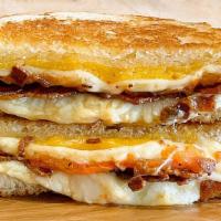 Ryan’S Melt · Bacon, gruyere, cheddar & Parmesan cheese grilled to perfection with roasted tomatoes. Choic...