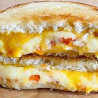 Ultimate Grilled Cheese Melt · Gruyere, cheddar & Parmesan cheese grilled to perfection with roasted tomatoes. Choice of br...