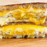 Ultimate Breakfast Melt · Pan-fried egg, gruyere, cheddar & Parmesan cheese grilled to perfection. Choice of bread.