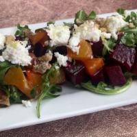Roasted Beet Salad · red and gold beets, arugula, candied walnuts, goat cheese tossed with a light lemon vinaigre...
