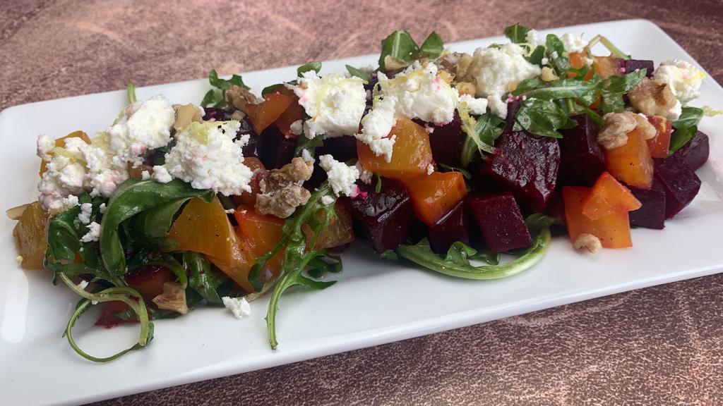 Roasted Beet Salad · red and gold beets, arugula, candied walnuts, goat cheese tossed with a light lemon vinaigrette