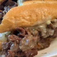 Prime Rib French Dip · Thin sliced prime rib with caramelized onions, white cheddar and creamy horseradish sour cre...