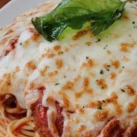 Colossal Chicken Parmesan · crispy breaded chicken layered with marinara, fresh mozzarella, parmesan and romano, roasted...