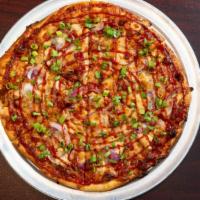 Chaos Bbq Pizza · BBQ sauce, provolone, smoked mozzarella, roasted chicken, red onion, roasted garlic and fres...
