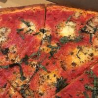 Margherita Pizza · Marinara, chunks of house-made marinated mozzarella and fresh basil.