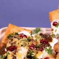 Papdi Chaat · aka Indian Nachos. Fried puffy chips, topped with boiled potatoes & chickpeas, topped with s...