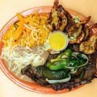 Mi Pueblo Especial · Steak seasoned with our special spices topped with grilled onions and chile pasilla. Prawns ...