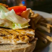 Grilled Chicken Sandwich · White American cheese, lettuce and tomato. Served with choice of house made potato chips, co...