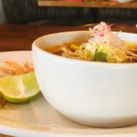 Cup Pozole · Pork shoulder, ancho chile, hominy, mexican oregano, radish, cabbage, tortilla strips, lime