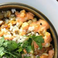 Mexican Street Corn · Grilled corn, cotija, cilantro, onion, garlic, chiptole aioli, crema, jack cheese
