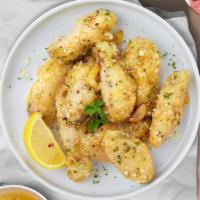 Crazy Garlic Cheese Wings (Boneless) · Boneless breaded fresh chicken wings, fried until golden brown, and tossed in garlic and par...