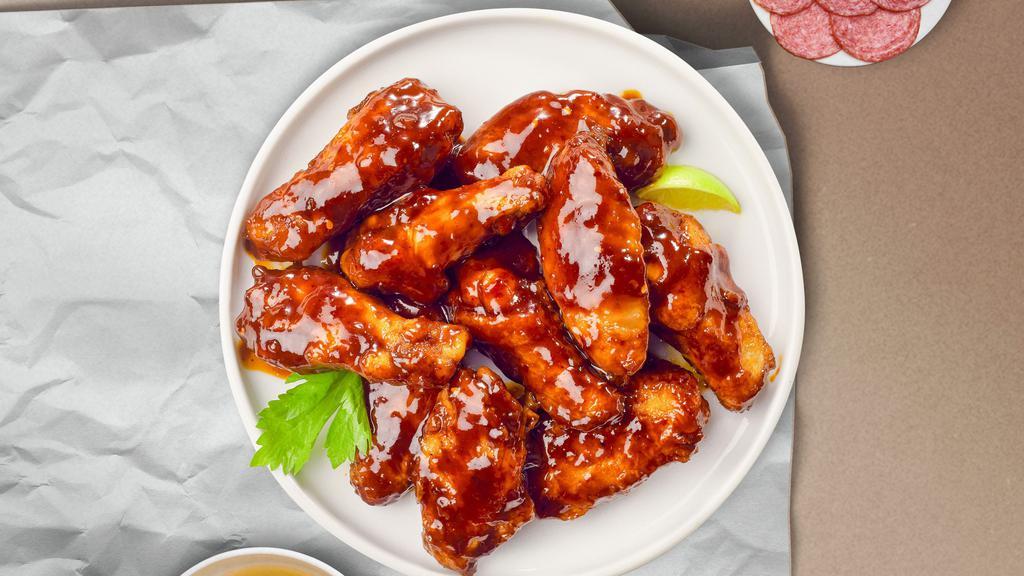 Bring Home The Bbq Wings (Boneless) · Boneless breaded fresh chicken wings, fried until golden brown, and tossed in barbecue sauce. Served with a side of ranch or bleu cheese.