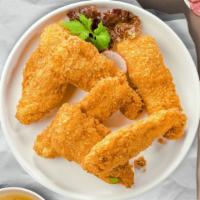 Crispy Chicken Tenders · Chicken tenders breaded and fried until golden brown. Served with your choice of dipping sau...