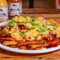Loaded Brisket Fries · Feeds 2-3. Topped with smoked brisket, green onion, melted Cheddar Jack cheese, & BBQ sauce.