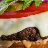 Cheezy Cheeseburger · 6 oz. - Angus Beef Patty, w/double white American cheese, lettuce, tomato & red onions, on a...