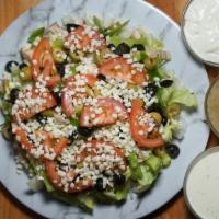 Garden Salad · Fresh onions, green peppers, mushrooms, black and green olives, tomato's, topped with mozzar...