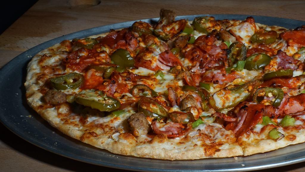 Wild Pepper · Pepperoni, sliced ham, Italian sausage, red peppers, buffalo sauce, jalapeños, green peppers, yellow peppers, onions, mozzarella cheese.