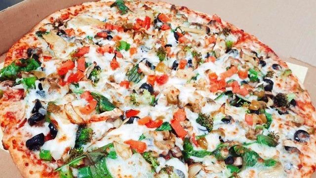 Veggie Lovers · Green pepper, onions, mushrooms, black olives, green olives, artichoke hearts, tomatoes, spinach, sun-dried tomatoes, broccoli.