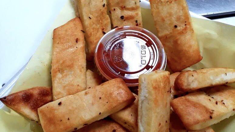Bread Sticks · Seasoned with garlic butter, parmesan cheese and come's with side of marinara.
