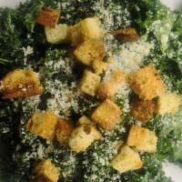 All Kale Caesar! · Marinated kale, parmigiano reggiano, Caesar dressing, garlic crouton and lemon wedge.