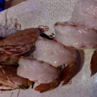 Ama Ebi (Sweet Shrimp) · Sushi 2pc. Raw shrimp from Japan with deep-fried head.