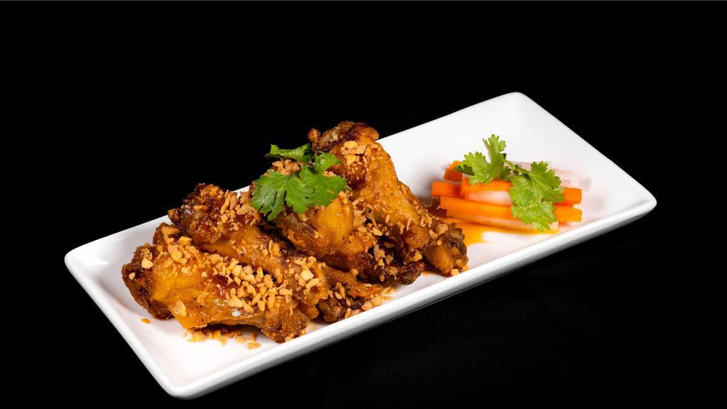Bamboo House Wings · Crispy chicken wings caramelized in house garlic fish sauce.