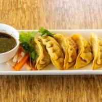 Pot Stickers · Crispy chicken and vegetables pot stickers,
served with house dumpling sauce