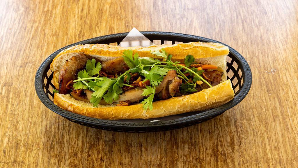 Vietnamese Sandwich (Banh Mi) · Baguette, pickle daikon & carrot, mayonnaise, cilantro, crush peanut, shallot, and house sauce