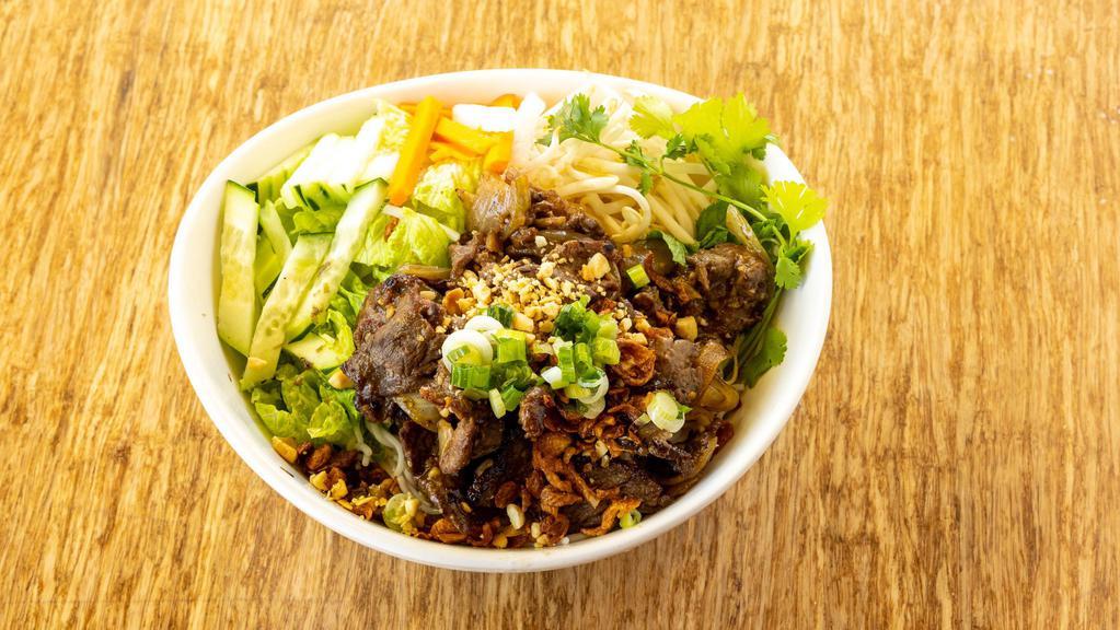 Ginger Beef Stir-Fry Bowl · Beef, ginger, onion fresh herbs, cucumber, pickled vegetables, topped with crispy shallots and crushed peanuts, served with fish sauce.