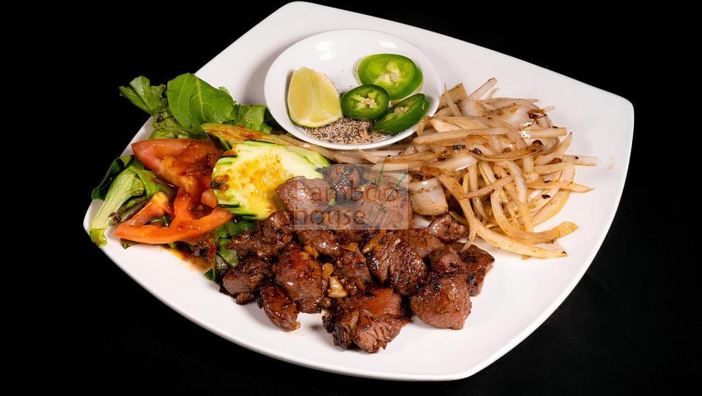 Shaking Beef (Bo Luc Lac) · Cube tenderloin steak, spring mix salad, red onion, served with lime sauce, serve with rice