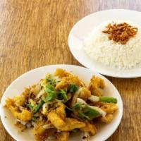 Salt & Pepper Squid · Lightly battered, tossed in garlic butter, onions, scallions, and peppers. Serve with rice