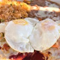 Ranch Style Flat Enchiladas Special · Vegetarian, spicy. Our own handmade corn tortillas smothered with red chile sauce and topped...