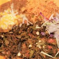 Carne Seca · Spicy. Dry beef, shredded and cooked with onions, tomatoes, and chile peppers. Served with f...