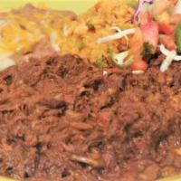 Barbacoa · Beef simmered overnight with added spices and herbs. Served shredded beef with flour tortilla.