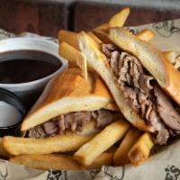#72. Prime Rib Dip · Premium Beef, tender thin-sliced, toasted French Roll, Au Jus.