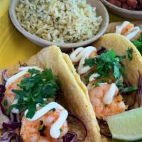 Camarones · Shrimp cooked in a chili garlic butter, red cabbage, cilantro, topped with chipotle mayo